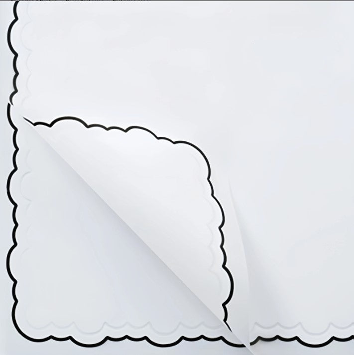 White paper with scalloped edge and text indicating size and quantity on a white background