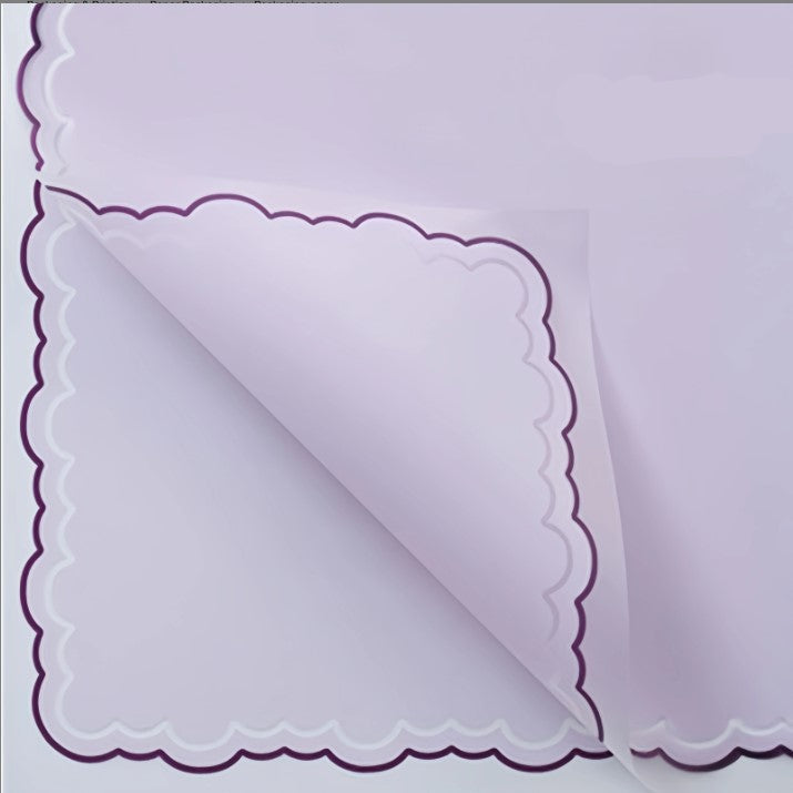 Purple paper with scalloped edge and measurement details on a white background