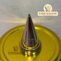 Metallic piping tip on a yellow surface with 'Bake Bazaar' branding.
