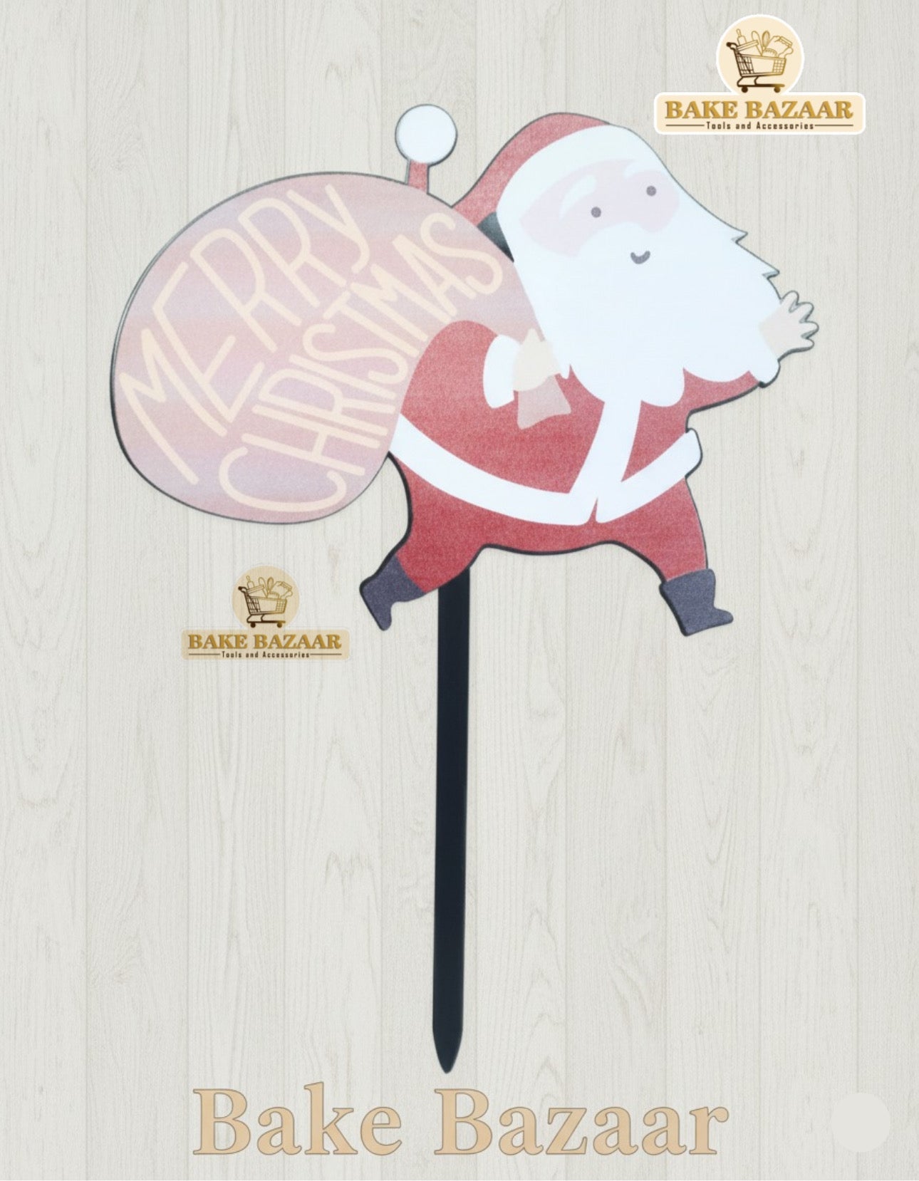 Decorative Christmas stake with Santa Claus design and 'Merry Christmas' text, branded 'Bake Bazaar'.