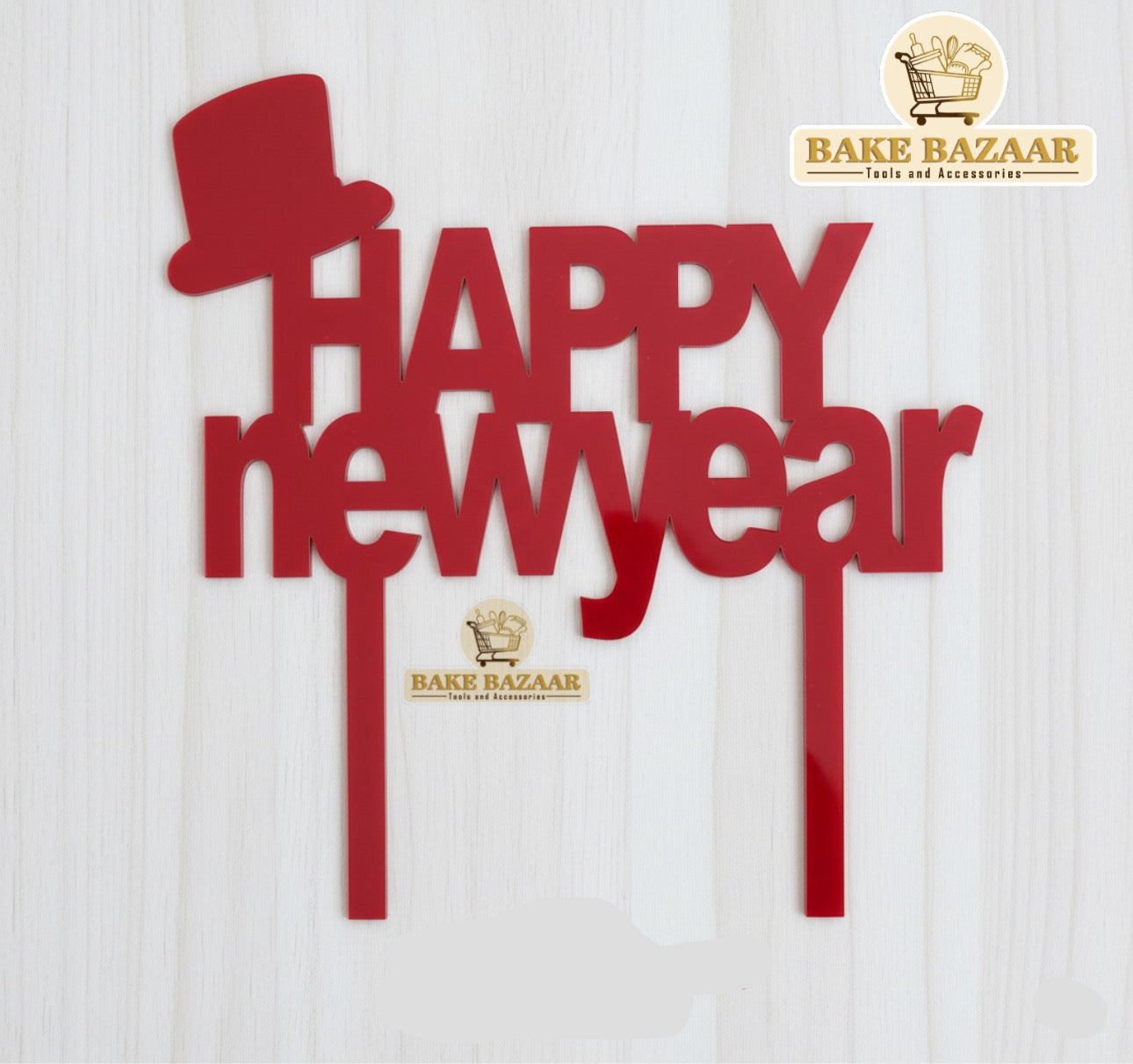 Red 'Happy New Year' decoration with a top hat on a white background, branded as Bake Bazaar.