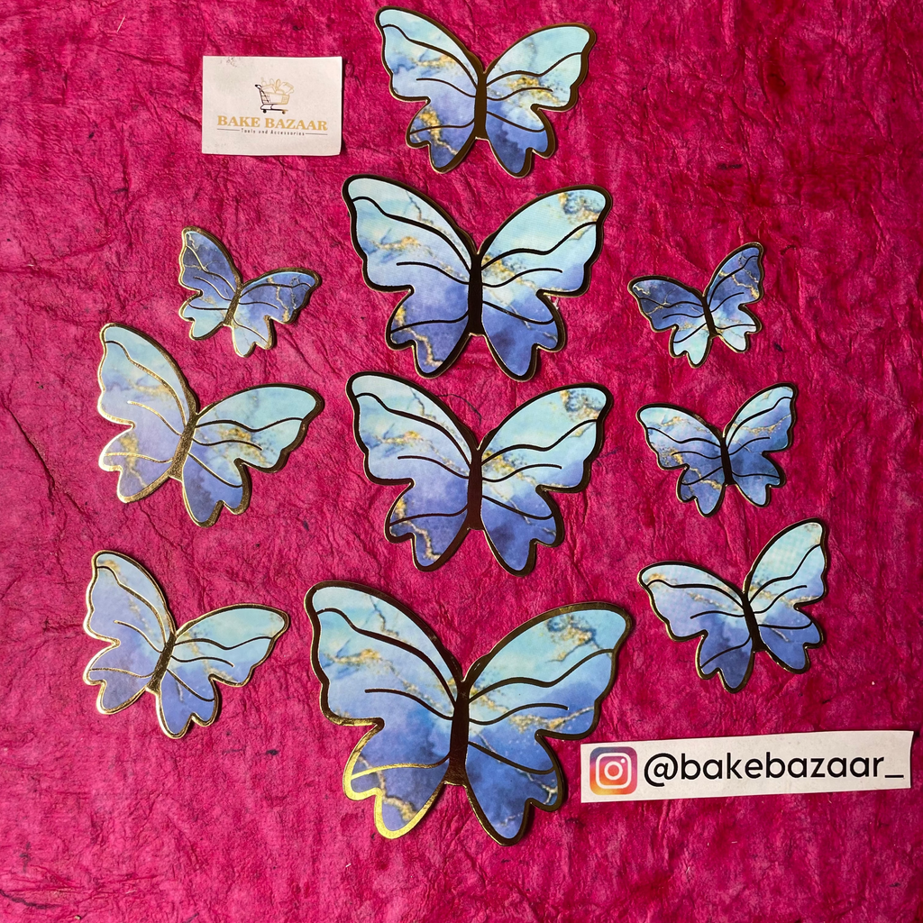 Butterfly-shaped cookies on a pink surface with 'bakebazaar' branding.