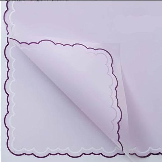 Purple paper with scalloped edge and measurement details on a white background