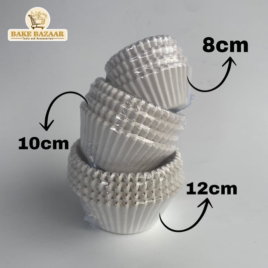 Stack of white cupcake liners with measurements on a gray background, featuring the Bake Bazaar brand.
