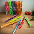 Colorful plastic toy swords on a gray background with packaging in the background.